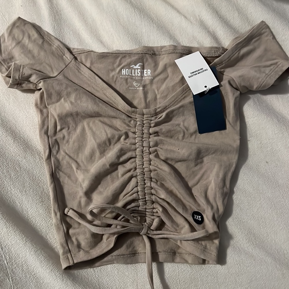 Hollister cropped beige, cinched tie shirt, size xxs